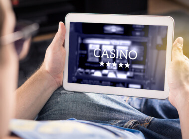 a man playing at an online casino on his tablet