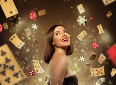 A woman smiling as the accoutrements of casino gaming such as cards, dice, and chips spin around her.