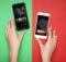 a woman's hands with two smartphones. On one is the word poker and on the other is the word casino.