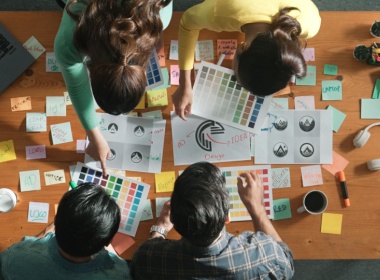 overhead view of a team working on graphics and animation for a new game