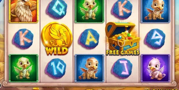 Slot game featuring cute griffin characters, gemstone letters, a golden Wild coin, and a treasure chest symbol labeled Free Games with a jackpot displayed at the top.