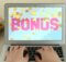 a man typing at his laptop with the word bonus in pink on the screen and gold coins floating all around